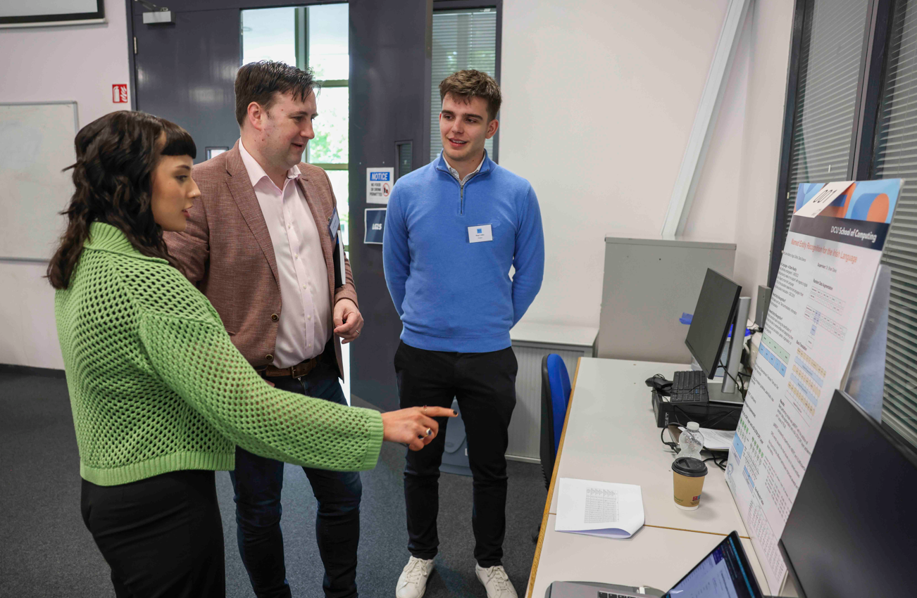 Conal O'Donnell, COO talking with DCU students about their projects