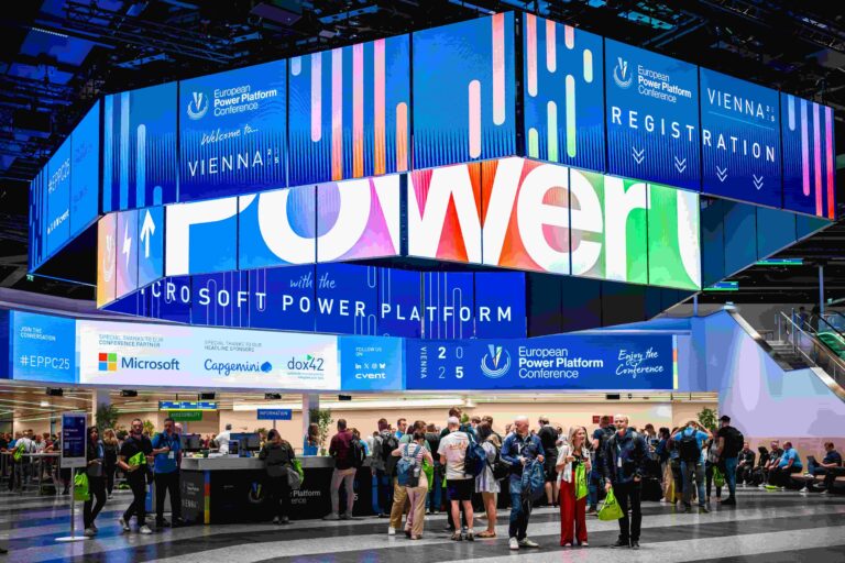 Crowds gathering at the vibrant registration area of the European Power Platform Conference 2025 in Vienna, illustrating the theme What we learned at the 2025 European Power Platform Conference.