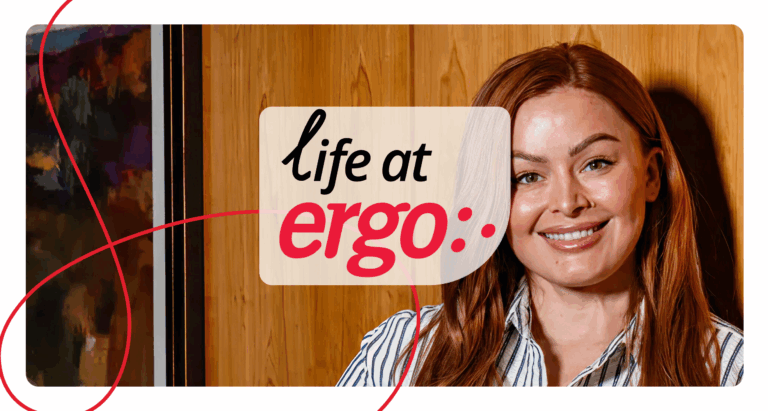 Wood-paneled background with text overlay reading ‘life at Ergo’ and a person seated in a professional setting, representing workplace culture.