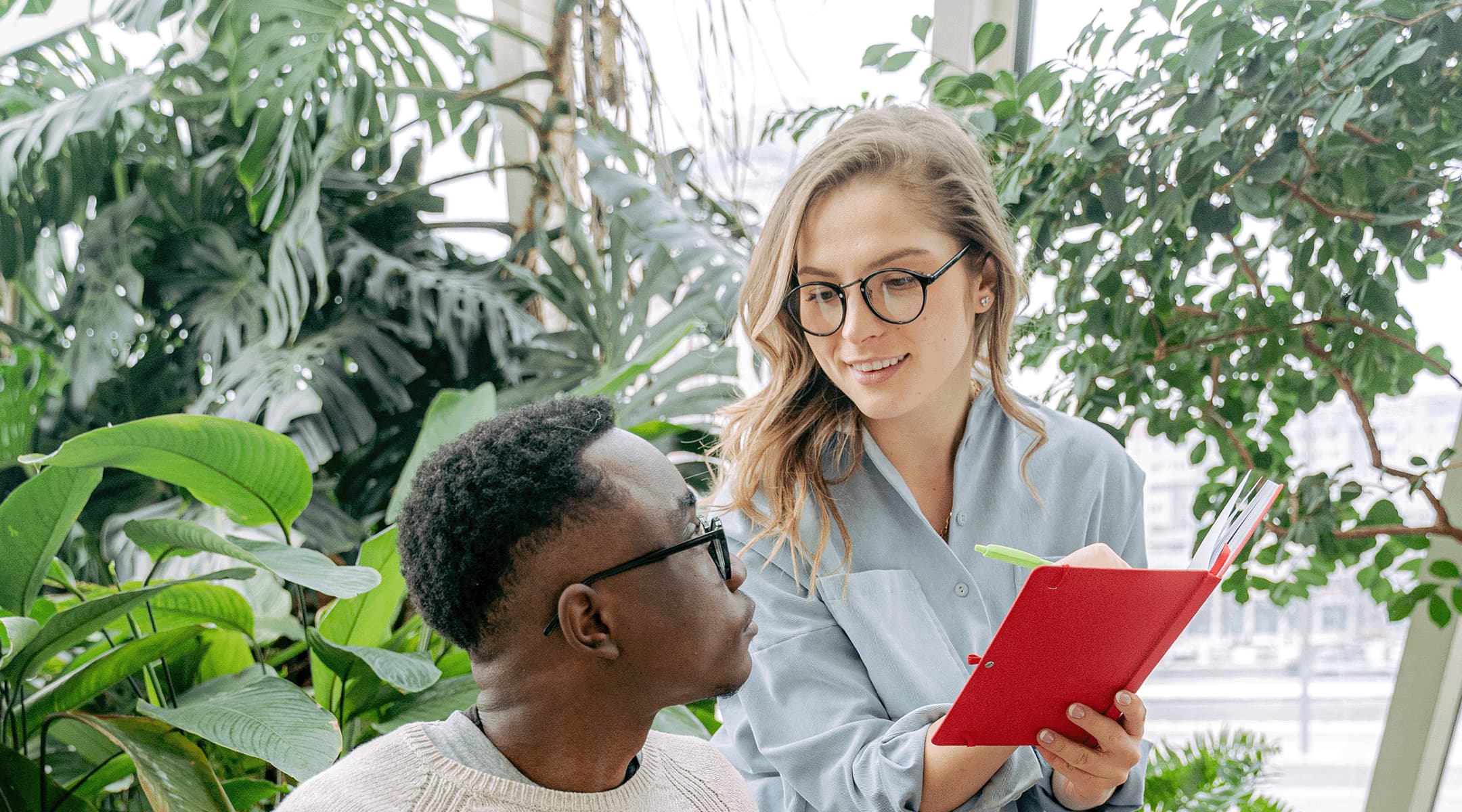 two professionals collaborating on microsoft 365 copilot empower