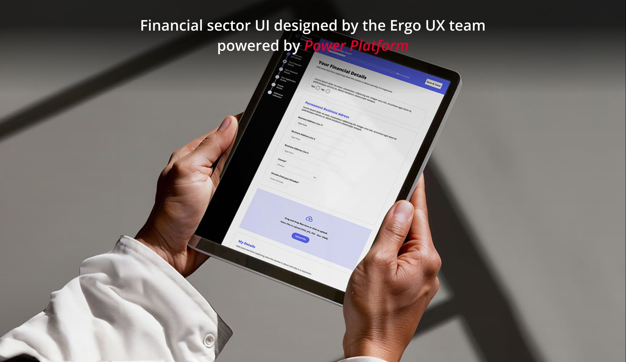 Person holding a tablet displaying a financial sector user interface designed by the Ergo UX team and powered by Microsoft Power Platform.